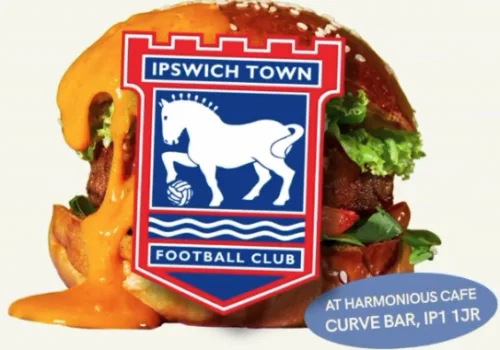 Loaded burger with an ITFC badge in front